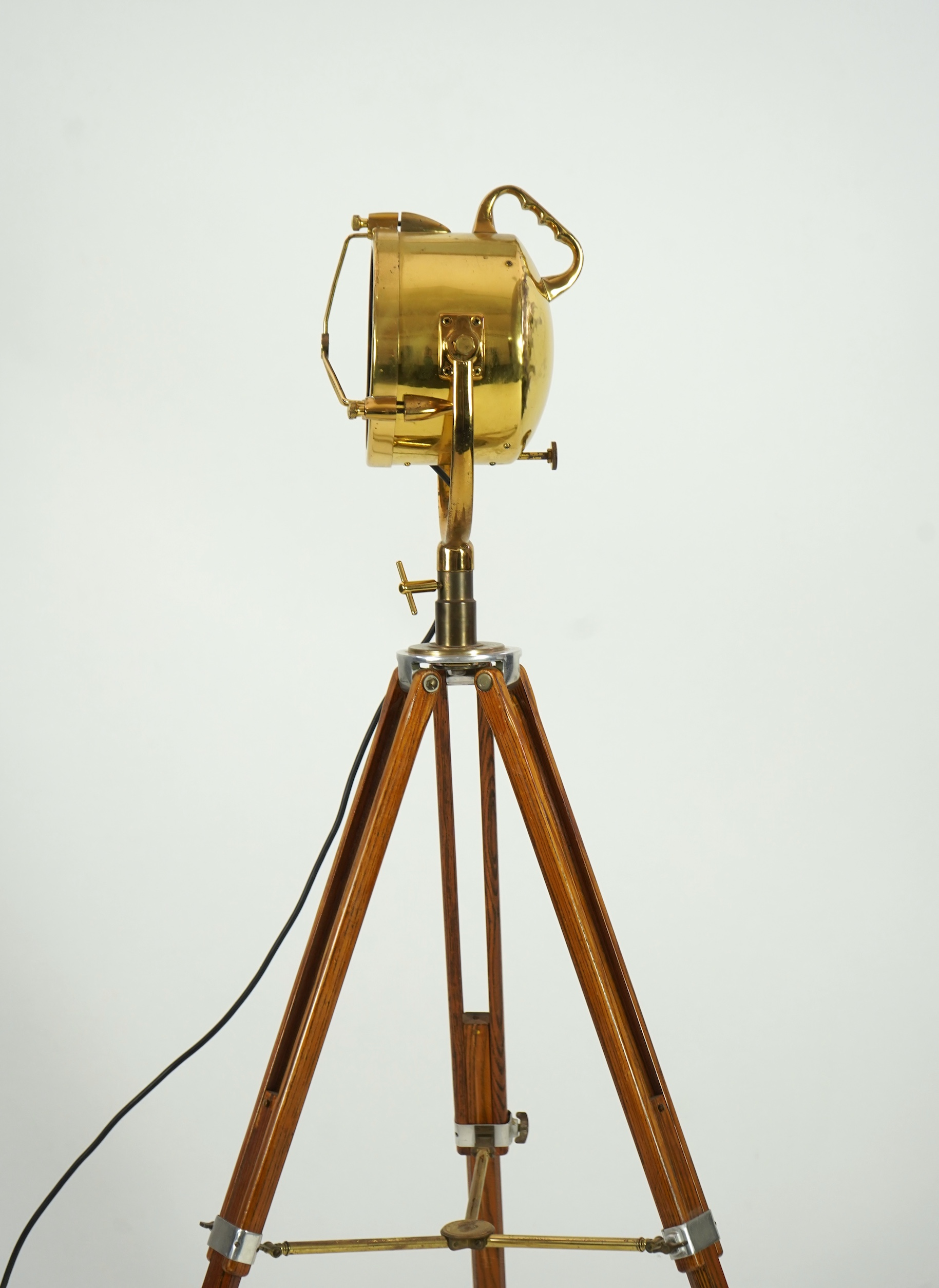A mid 20th century polished brass marine searchlight